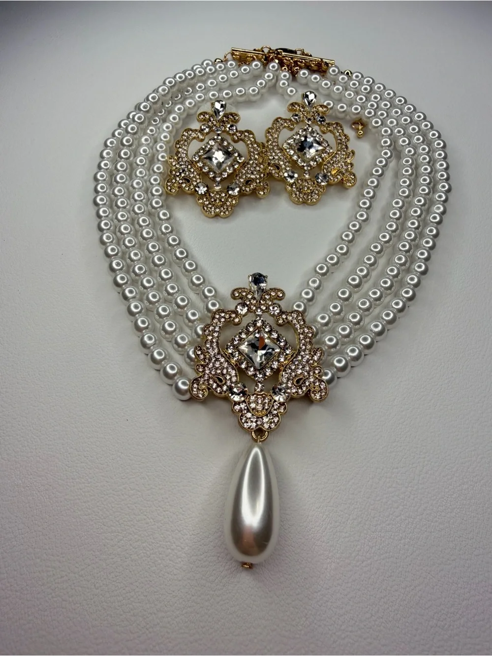 White Pearl Multi-Strand Necklace and Earring set with Gold and Crystal Pendant